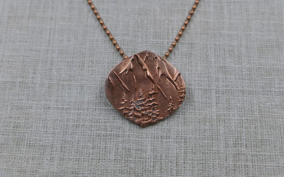 Copper Mountains and Pine Trees Sheild